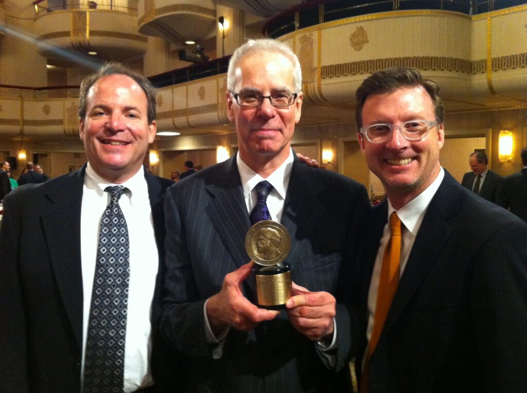 Ben Manilla with Mike Henry and Paul Marszalek accepting Pea Body Award